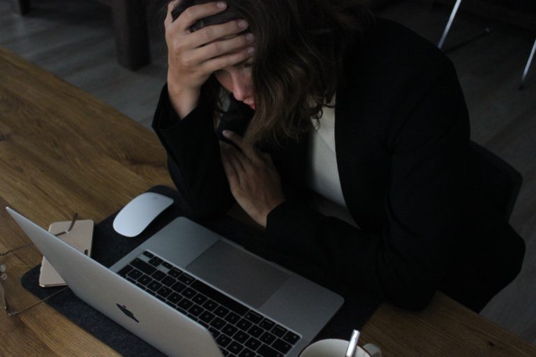 Woman overwhelmed by business matters